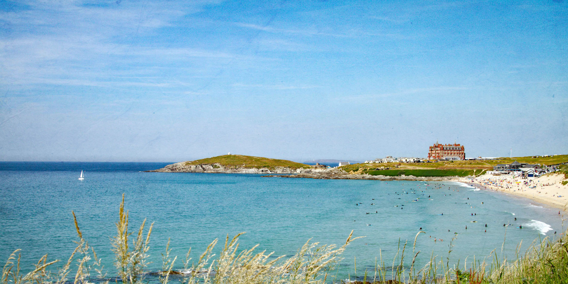 View of Fistral Beach with sea, beach and hotel in distance